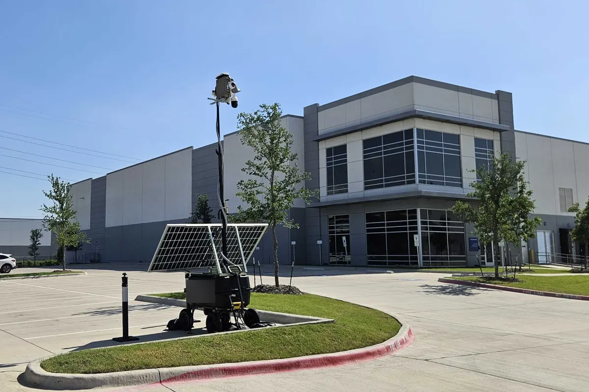 LOBO on a landscaped island in the parking lot of a new office and warehouse building.