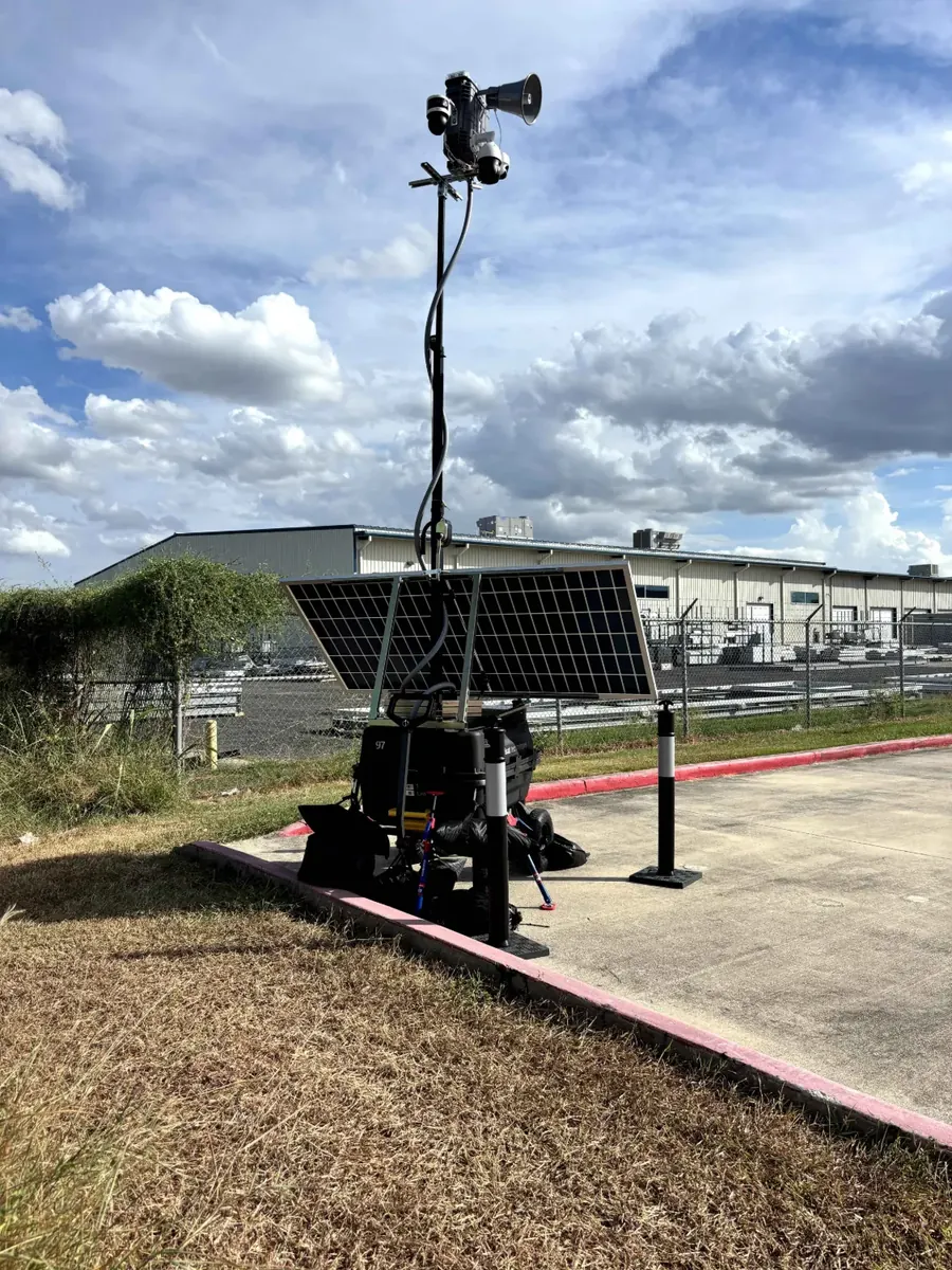 LOBO unit 97 at the curb of a fenced industrial yard.